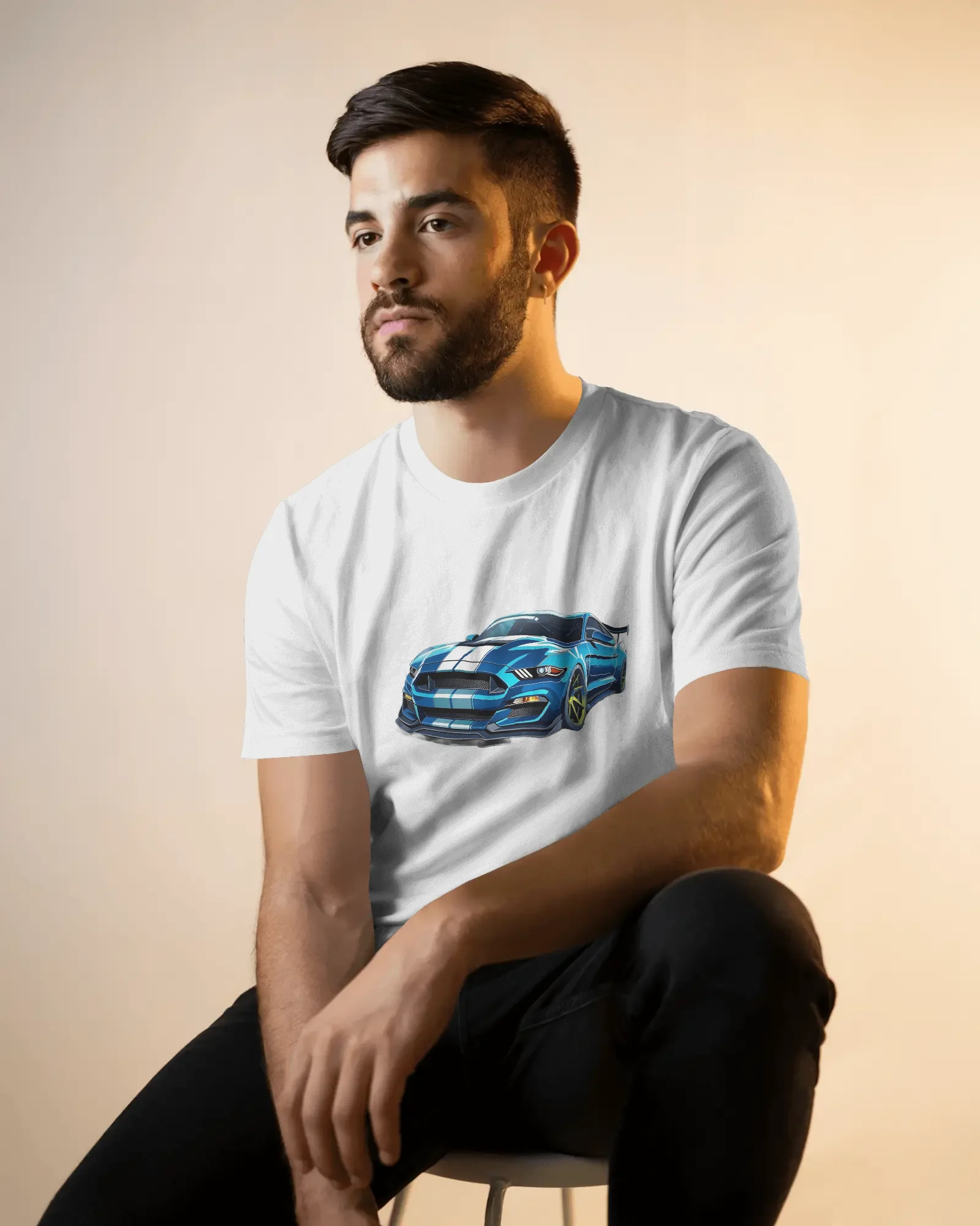 seated-male-model-t-shirt-mockup-in-soft-golden-light-with-casual-pose-and-neutral-backdrop-02134 (1) Shelby - Image 1