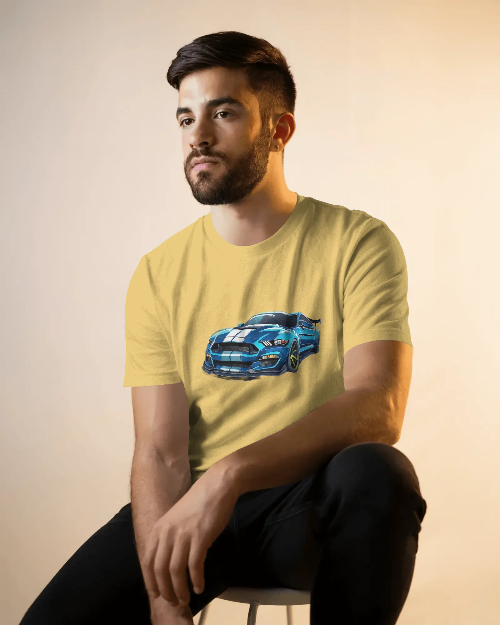 seated-male-model-t-shirt-mockup-in-soft-golden-light-with-casual-pose-and-neutral-backdrop-02134 (4) Mustang - Image 1