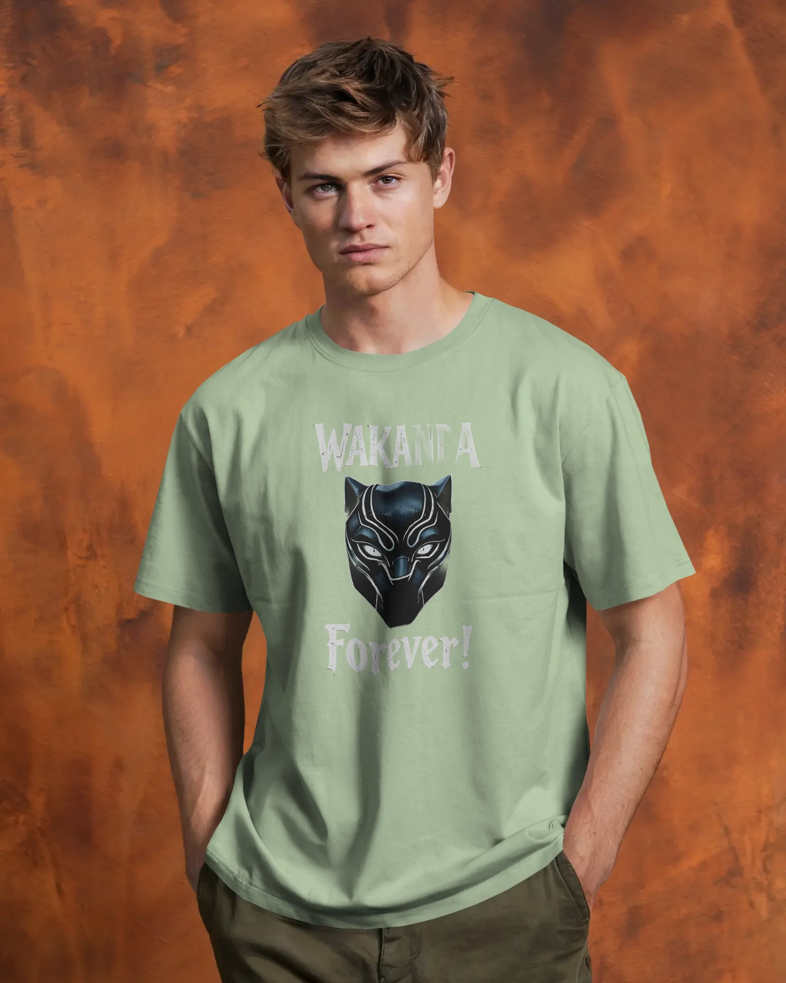 tshirt-mockup-male-model-front-view-hands-in-pockets-against-textured-orange-backdrop-confident-and-casual-pose-01776 (2) Wakanda - Image 1